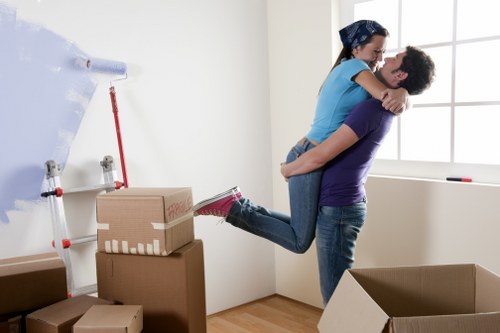 House movers carrying furniture through a residential property