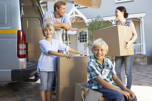 Moving team transporting household items with care